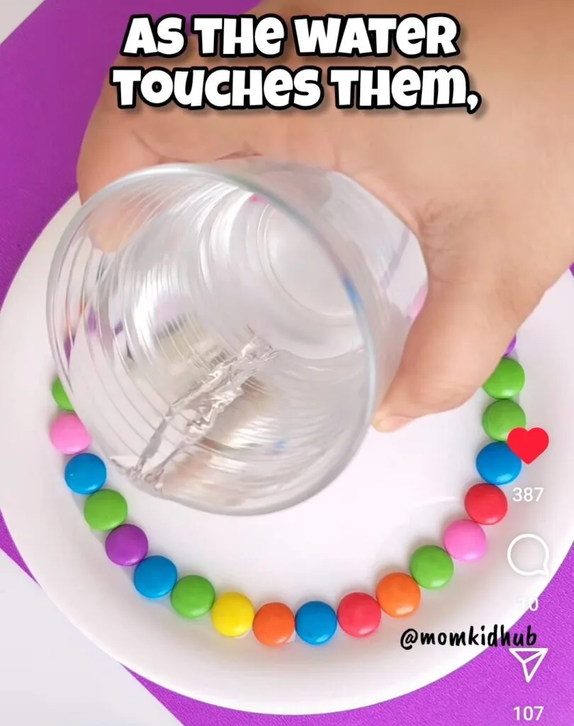Pouring warm water into center of M&M candy science experiment